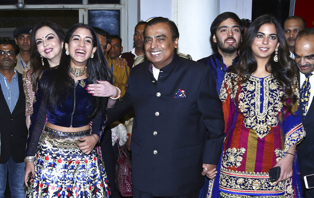 India's business tycoon Mukesh Ambani along with his wife Nita Ambani, daughter Isha Ambani and son 